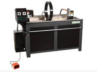 Magnetic Particle Inspection (MPI) machine used for non-destructive testing of metal components, showing headstock, coil, and magnetic bath unit.